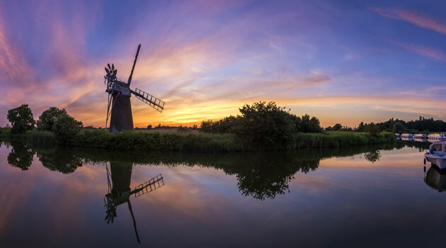 Photograph windmills at sunset