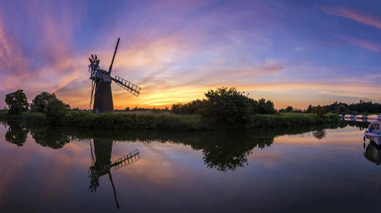 Photograph windmills at sunset
